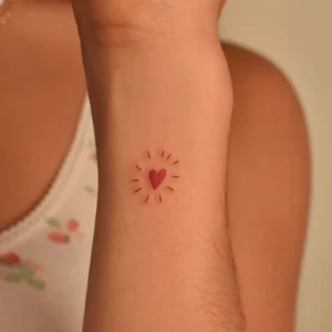 Add Sparkle to Your Style with This Red Heart Tattoo