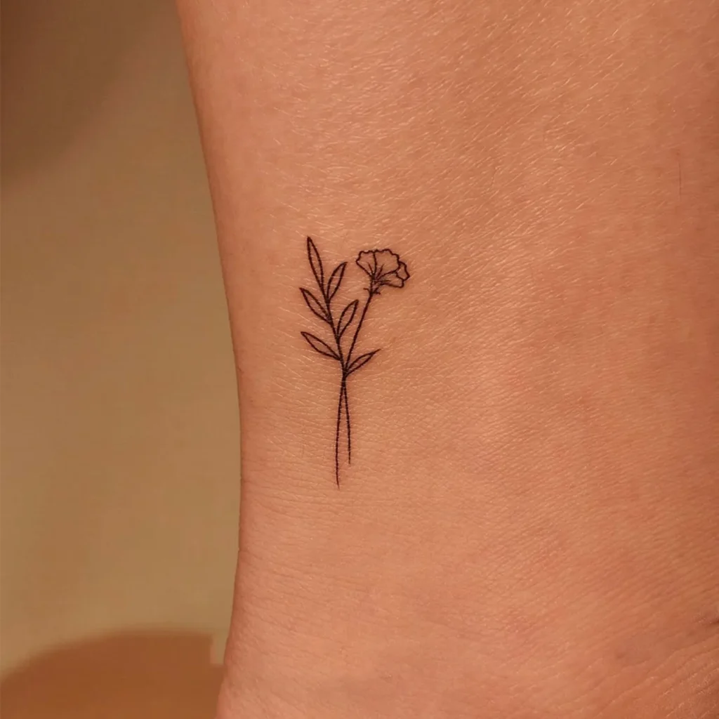 Capture Simple Elegance with This Single Carnation Line Art Boho Tattoo