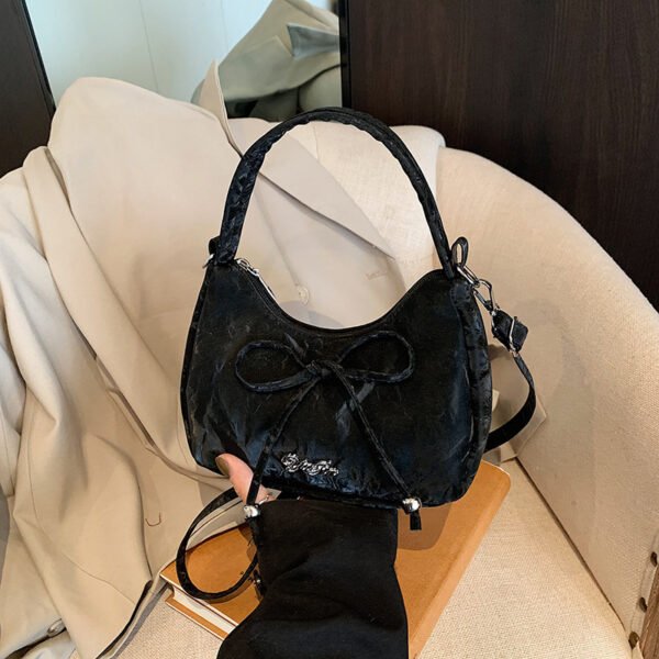Bow shaped crossbody bag in structured bow silhouette. Cute mini PU leather purse. Fits phone and essentials.