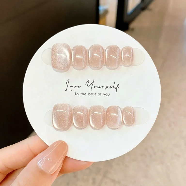 Short press on nails with cat eye glossy finish. Nude reusable fake nails for women. Easy to apply, natural look. XS, S, M sizes available.