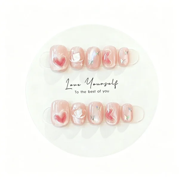 Pink purple press on nails with cat eye heart design. Romantic short fake nails for daily wear. Shimmer galaxy finish. Perfect for date night or everyday.
