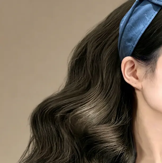 Cross front headband in vintage blue. Twisted leather hair band with high crown lift. One size fits most. Perfect for retro looks.
