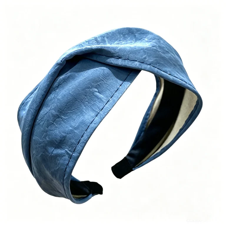 Cross front headband in vintage blue. Twisted leather hair band with high crown lift. One size fits most. Perfect for retro looks.
