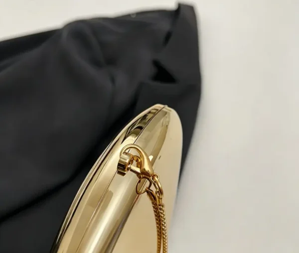 Evening clutch bag in sequin acrylic. Shell shaped hard case purse for parties, weddings, and date nights. Crossbody strap included.