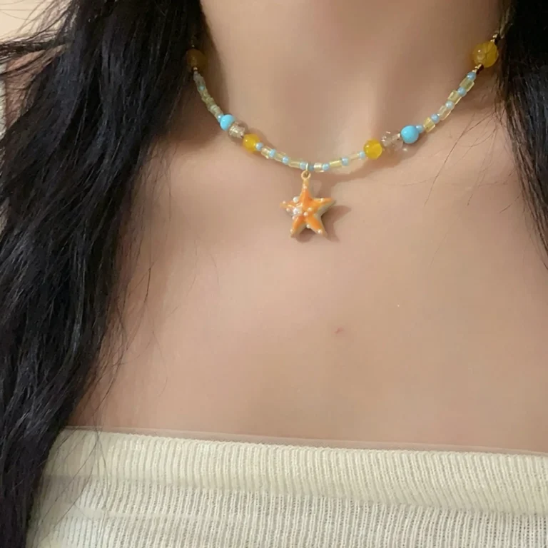Beaded choker necklace with starfish charms. Ocean themed summer beach jewelry for women. Handmade, colorful, and lightweight.