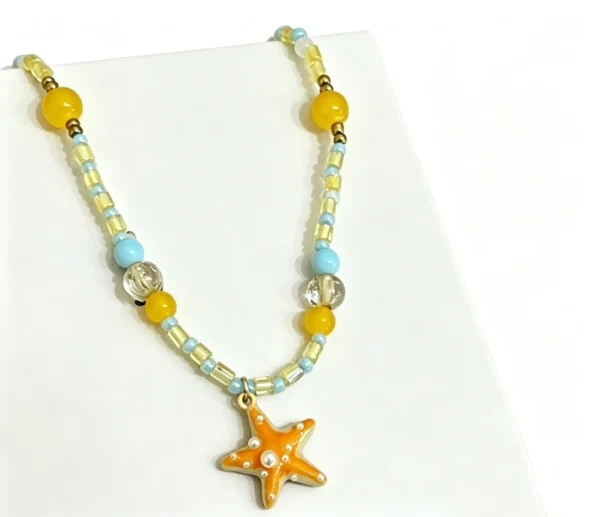 Beaded choker necklace with starfish charms. Ocean themed summer beach jewelry for women. Handmade, colorful, and lightweight.