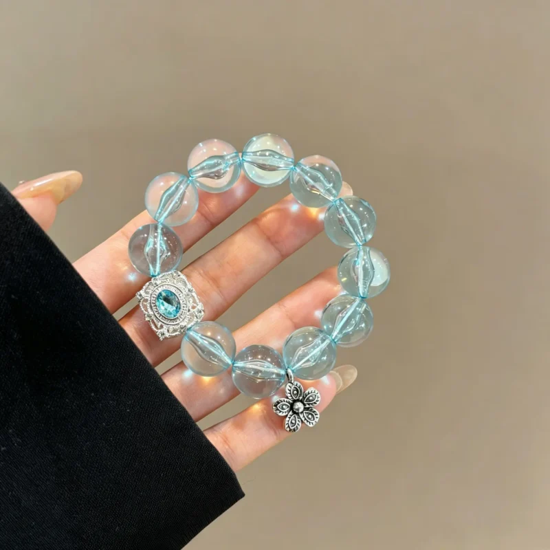 Mint green bracelet with beaded stretch design. Fresh summer wrist accessory for women. Lightweight and stackable.