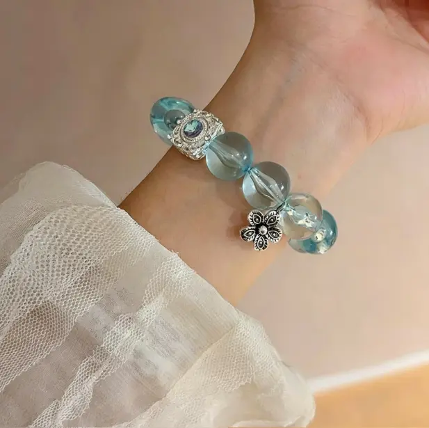 Mint green bracelet with beaded stretch design. Fresh summer wrist accessory for women. Lightweight and stackable.