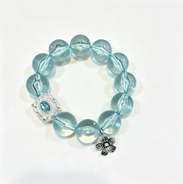 Mint green bracelet with beaded stretch design. Fresh summer wrist accessory for women. Lightweight and stackable.