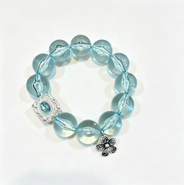 Mint green bracelet with beaded stretch design. Fresh summer wrist accessory for women. Lightweight and stackable.