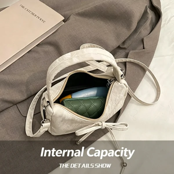 Bow shaped crossbody bag in structured bow silhouette. Cute mini PU leather purse. Fits phone and essentials.