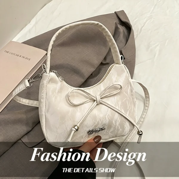 Bow shaped crossbody bag in structured bow silhouette. Cute mini PU leather purse. Fits phone and essentials.