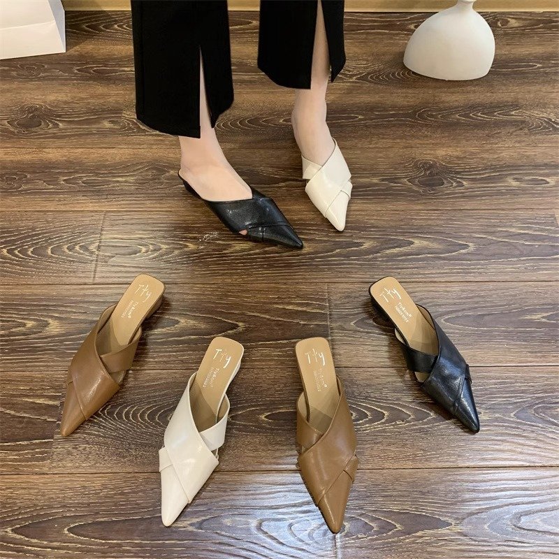 Womens mules with pointed toe and flat sole. Leather slip on shoes for everyday wear. French style loafers.