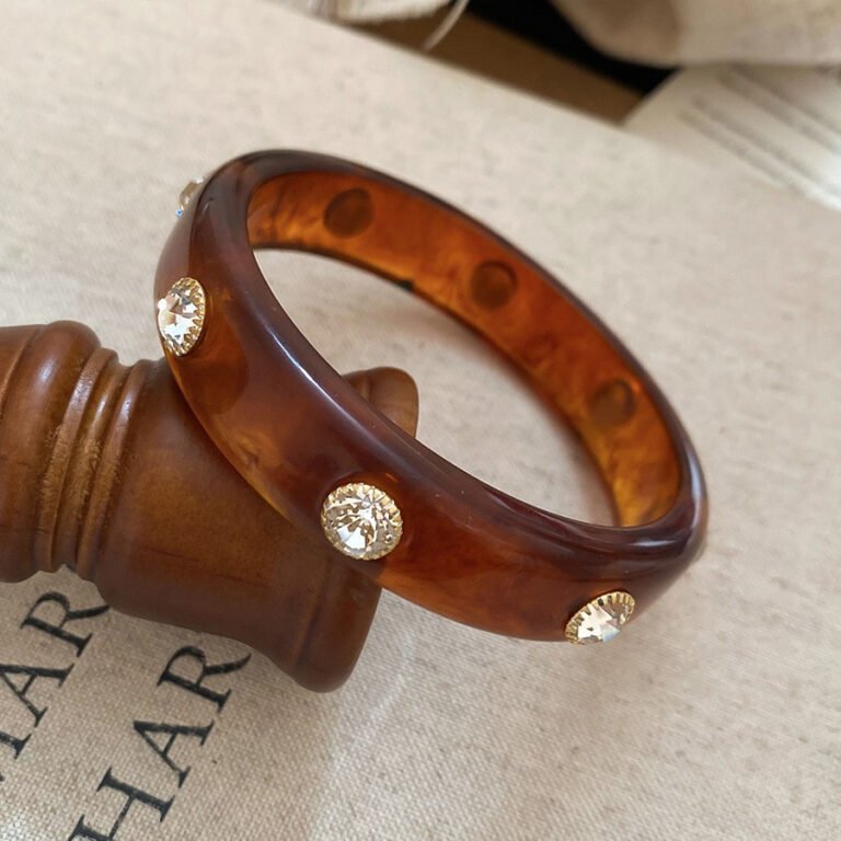 Tortoiseshell resin bangle on wrist