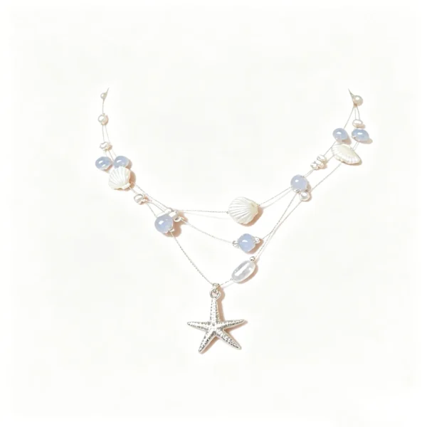 Shell necklace with starfish and pearl charms. Layered beachy choker for vacation. Lightweight and sweet.