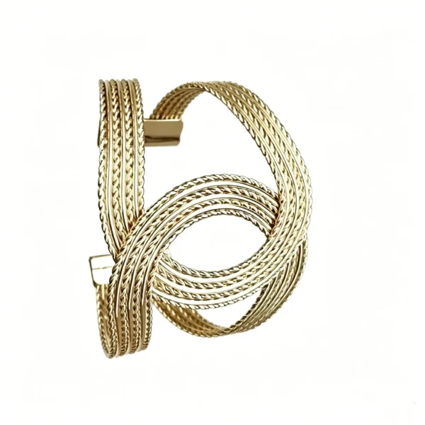 Twisted braided bracelet in vintage old money gold. Adjustable open cuff with woven texture. 14K gold plated.