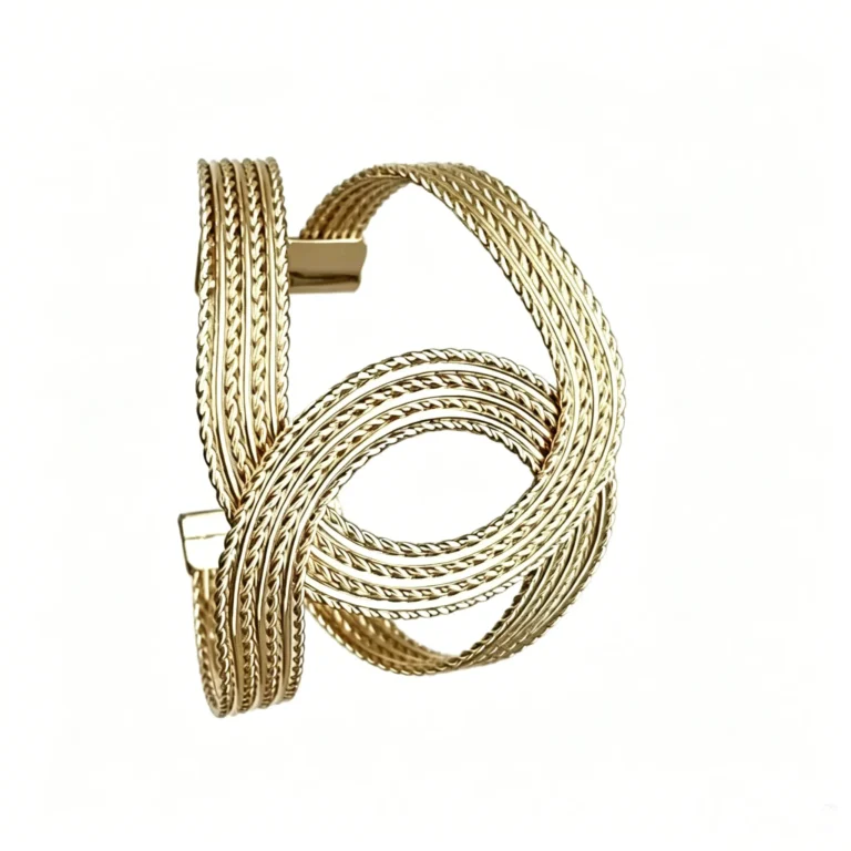 Twisted braided bracelet in vintage old money gold. Adjustable open cuff with woven texture. 14K gold plated.