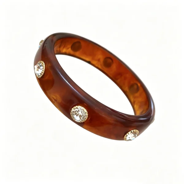 Tortoiseshell resin bangle on wrist