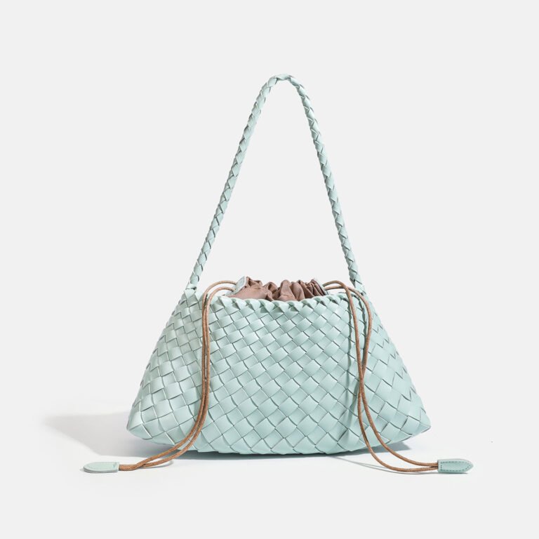 Woven shoulder bag in mint green on shoulder